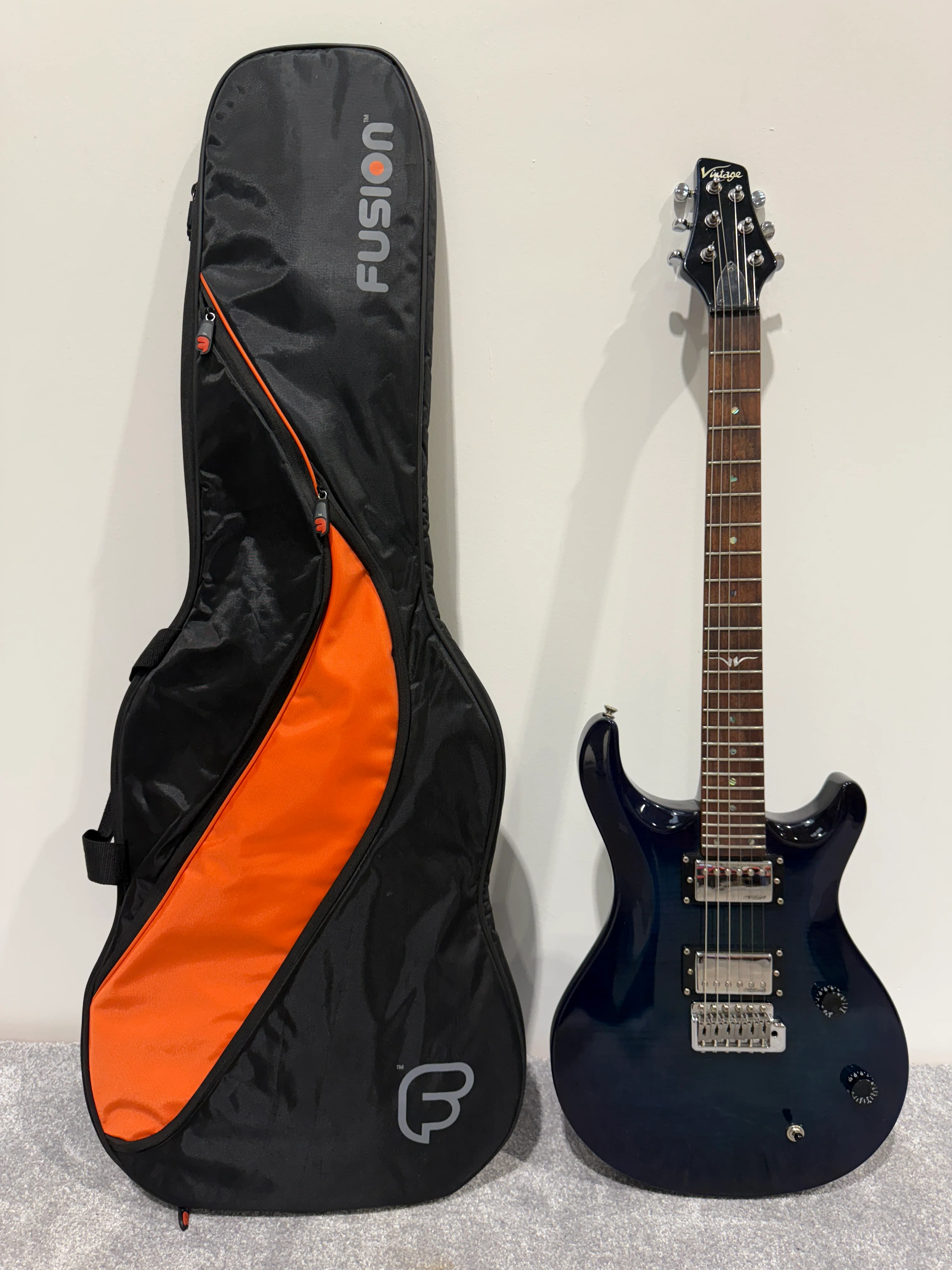 Vintage VRS 100 Trans Blue Electric Guitar - Fusion Carry Case - Tremelo Bar - Image 3